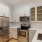 a kitchen with white cabinets