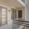 a patio with a black railing