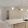 a kitchen with white cabinets and sink