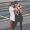 friends hugging on a street