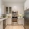 a kitchen with white cabinets