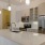 a kitchen with white cabinets