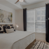 bedroom with bed and large window