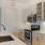 a kitchen with white cabinets