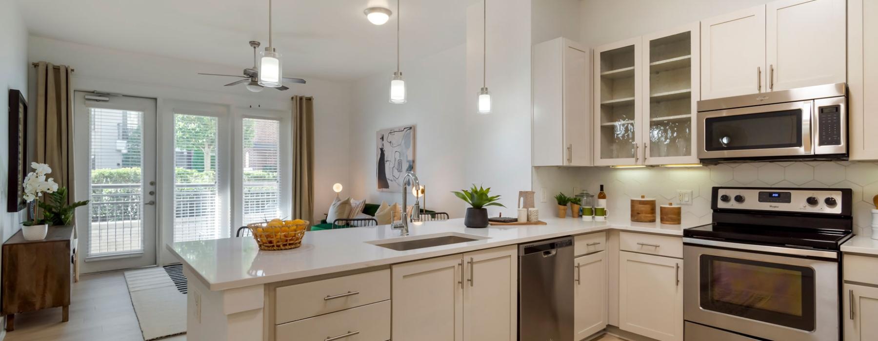 a kitchen with white cabinets