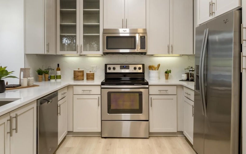 a kitchen with white cabinets