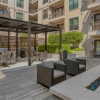 outdoor patio with seating and fire pit in a courtyard