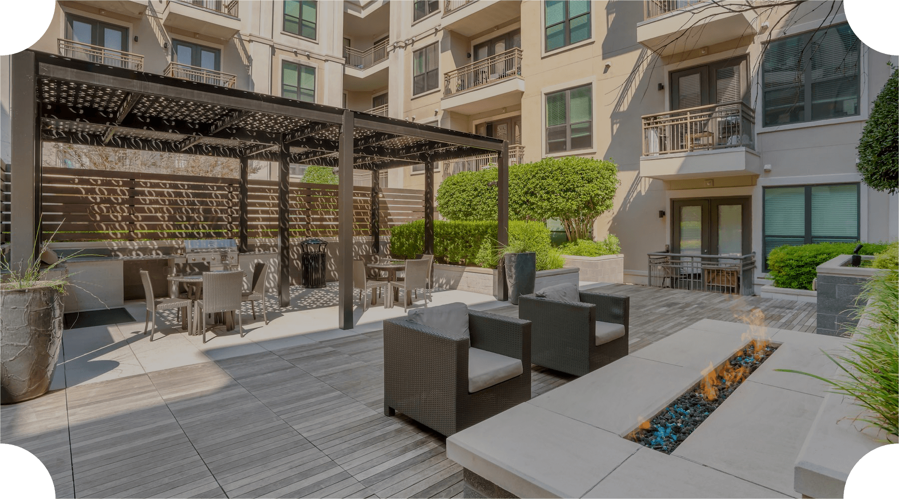 Access to resident only features outdoor patio with seating and fire pit in a courtyard