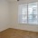 a room with a window and a carpet