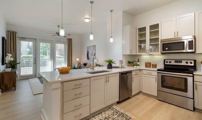 Spacious kitchens with thoughtful details a kitchen with white cabinets