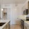a kitchen with white cabinets